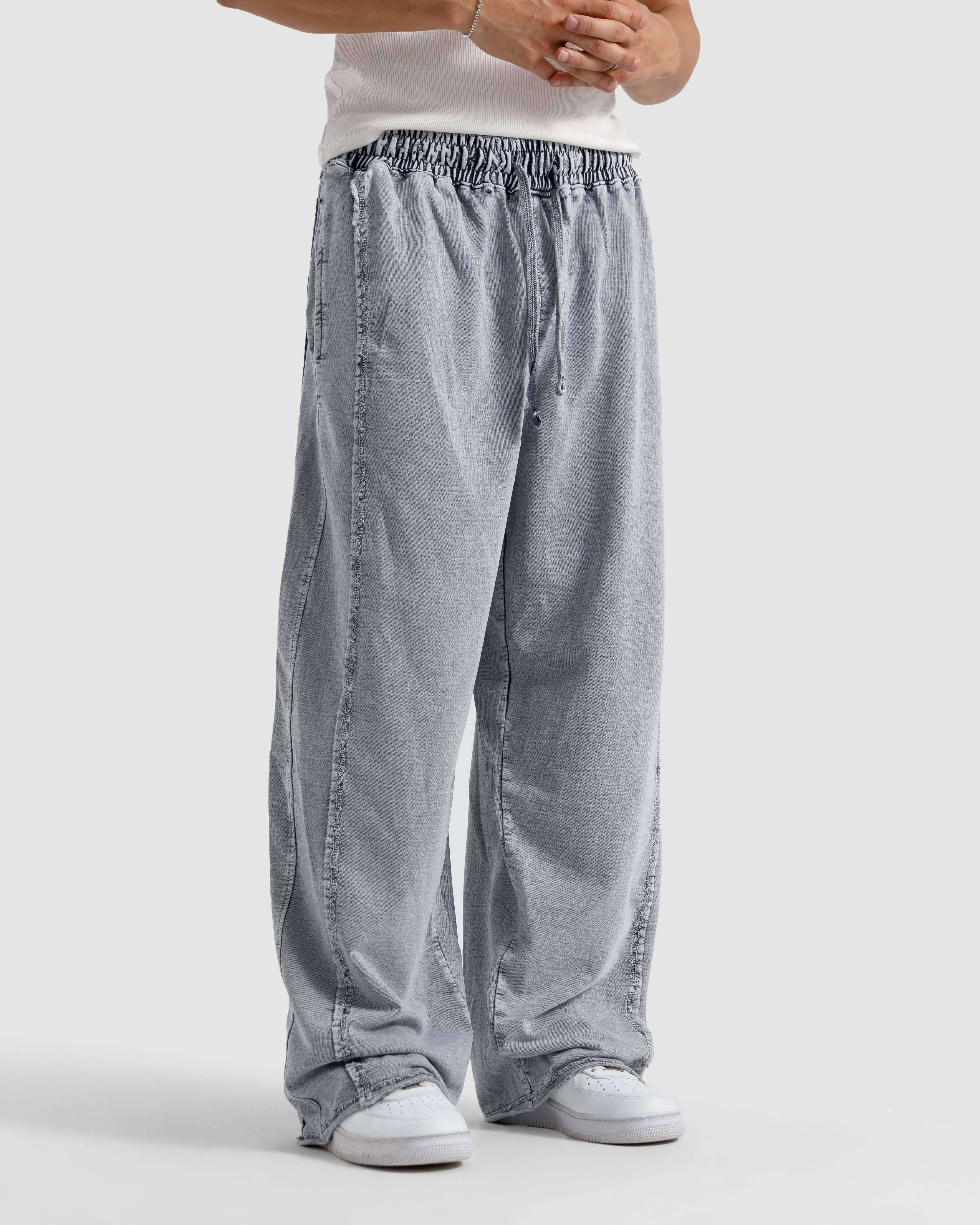 Washed Baggy Trousers With Raw Edges