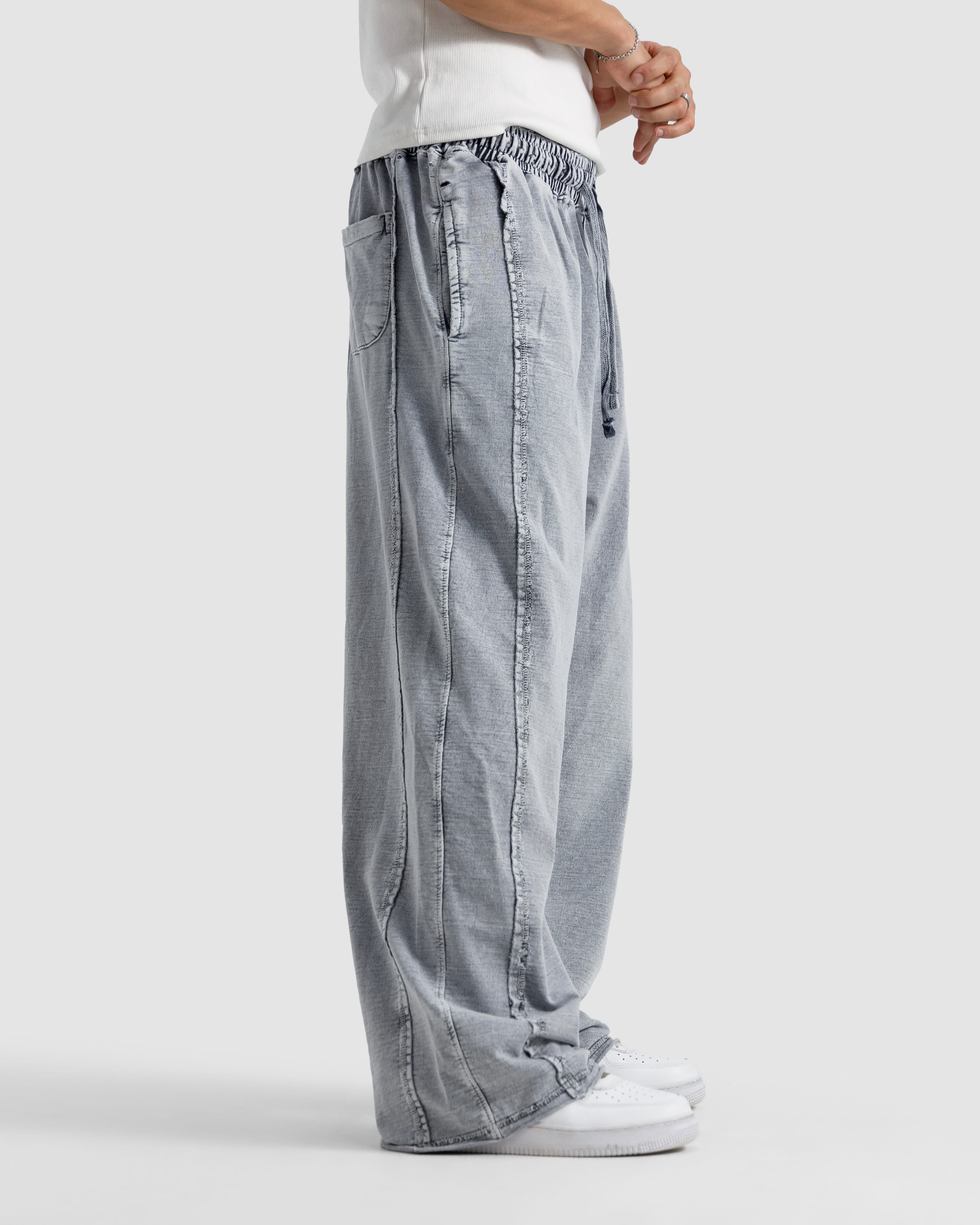 Washed Baggy Trousers With Raw Edges