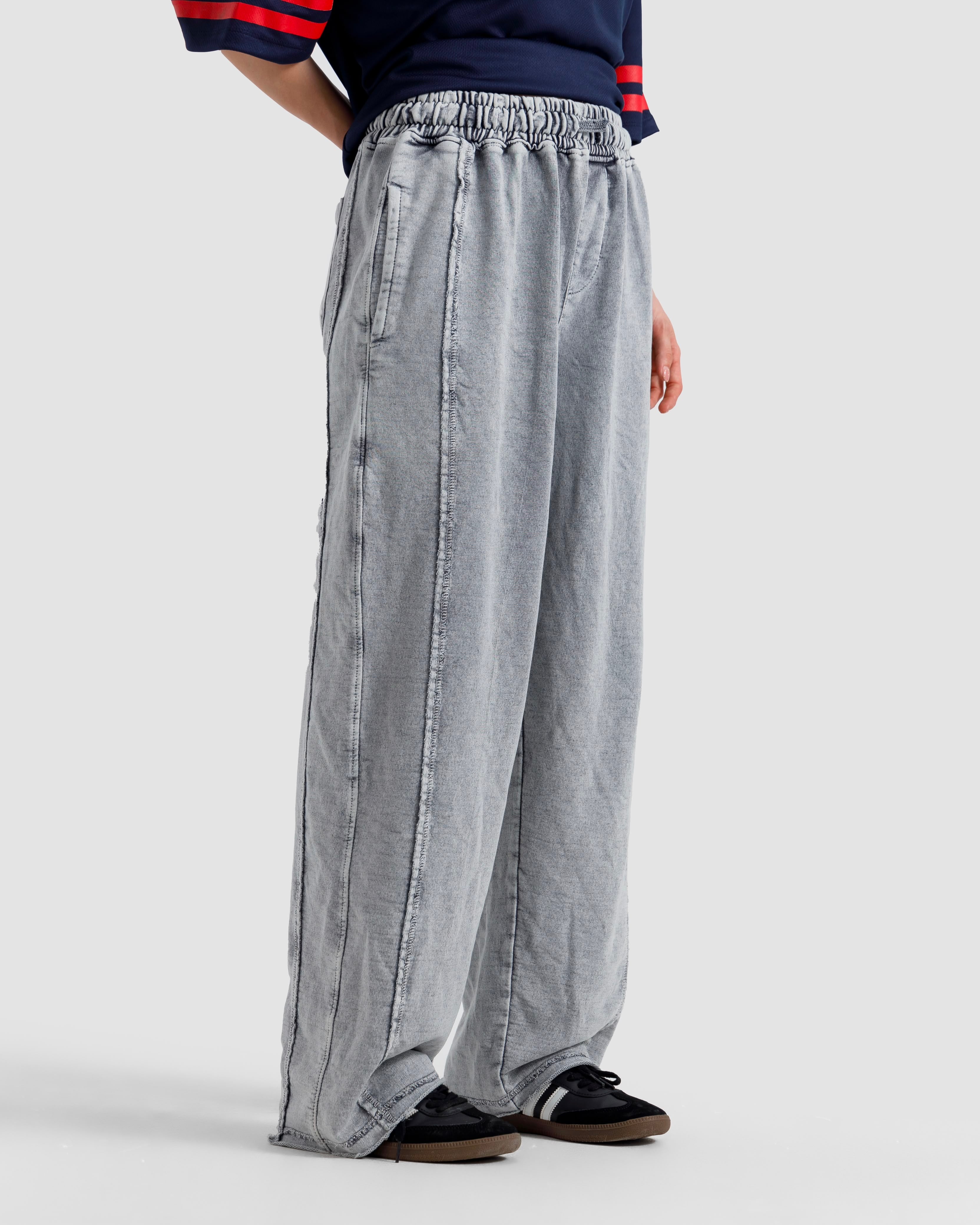 Washed Baggy Trousers With Raw Edges