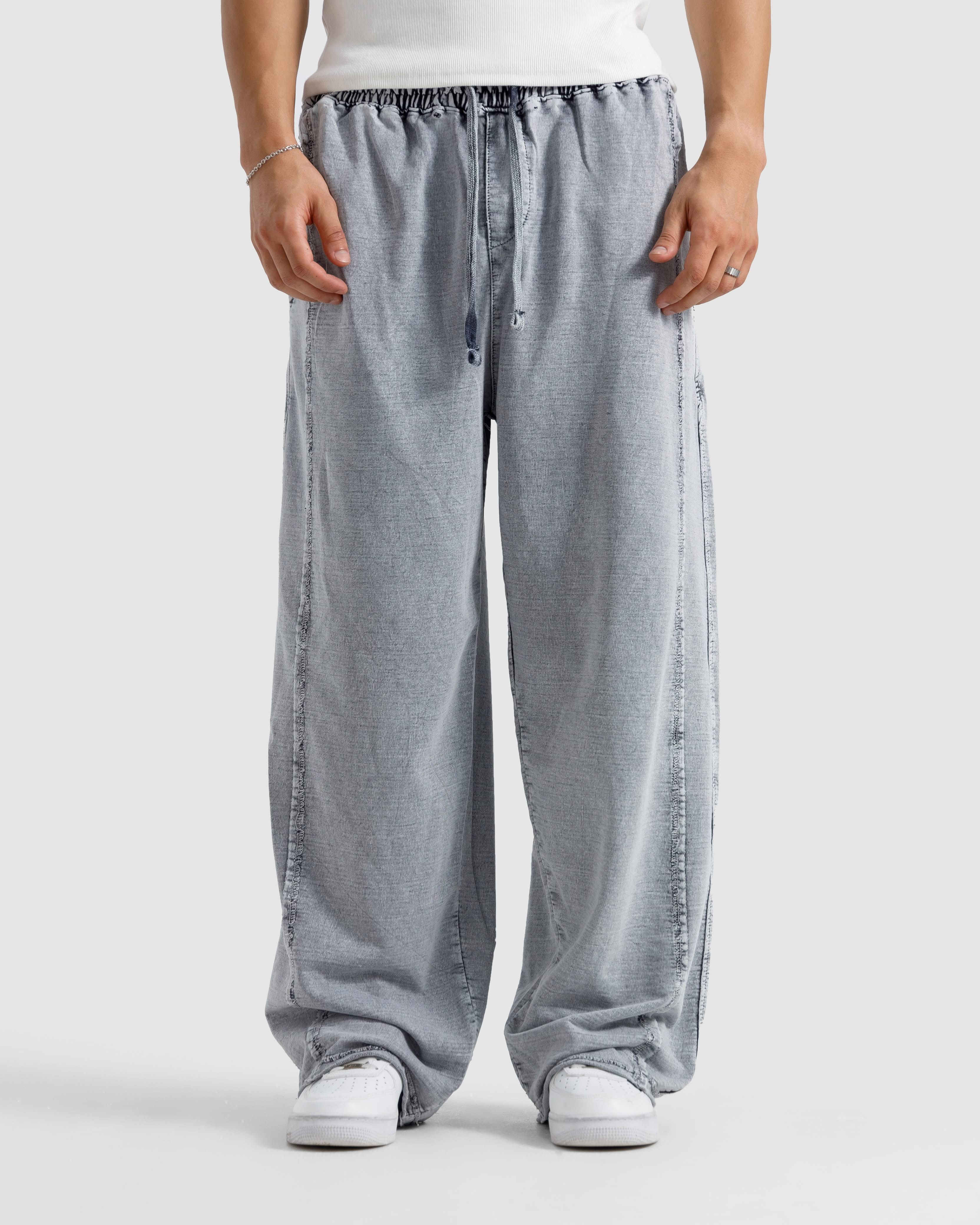 Washed Baggy Trousers With Raw Edges