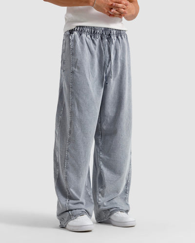Washed Baggy Trousers With Raw Edges