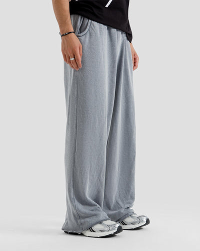 Washed Baggy Trousers With Raw Edges