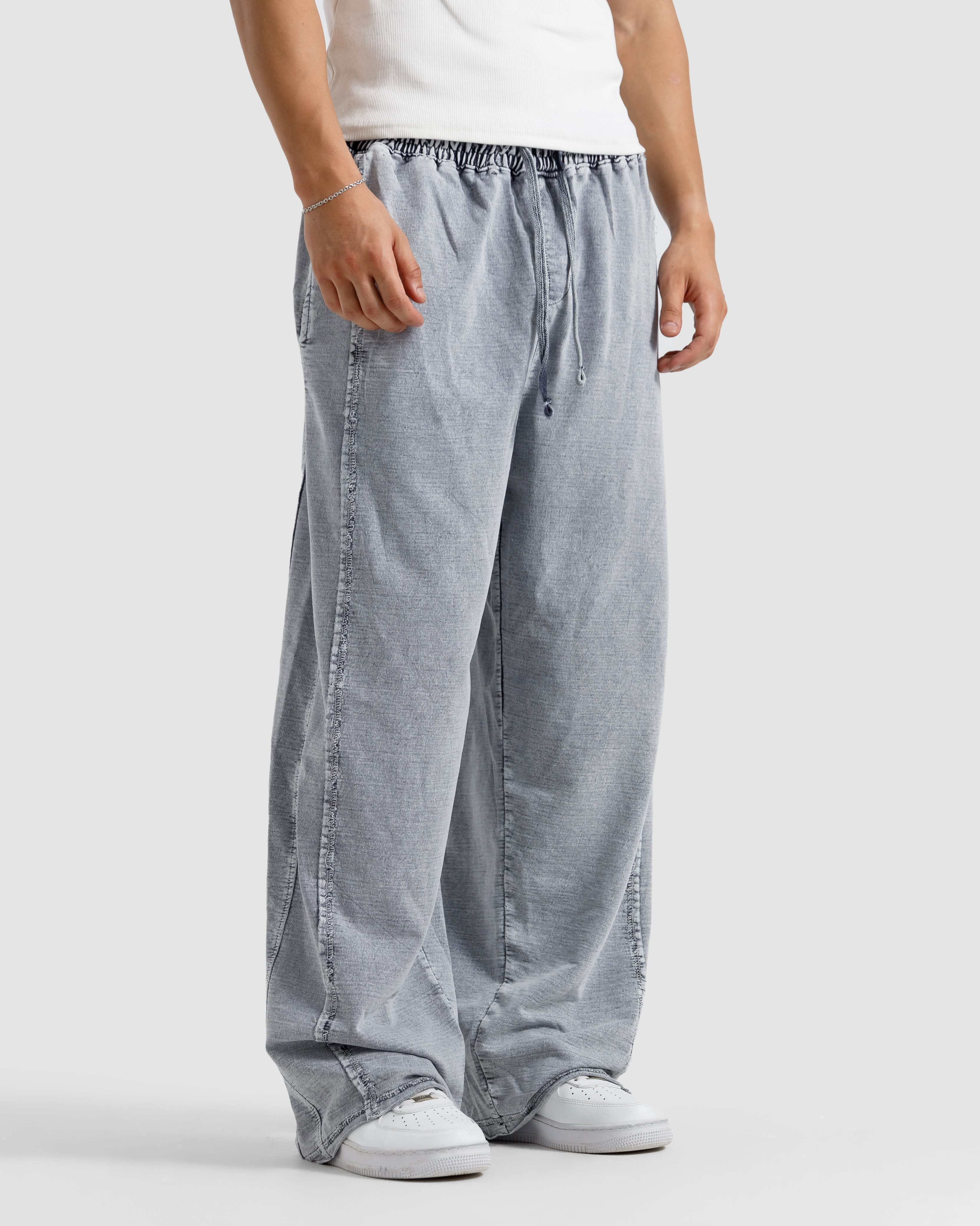 Washed Baggy Trousers With Raw Edges