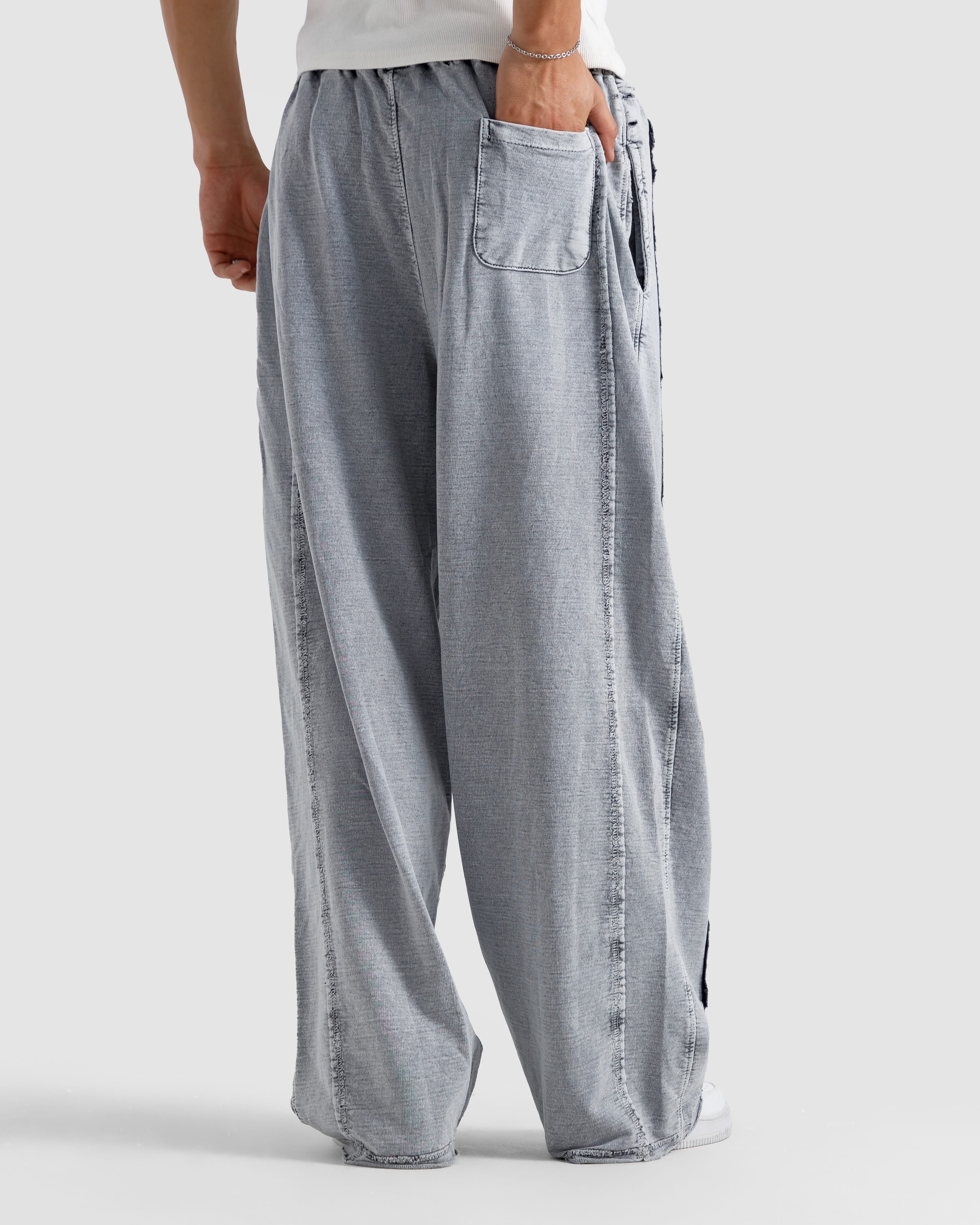 Washed Baggy Trousers With Raw Edges