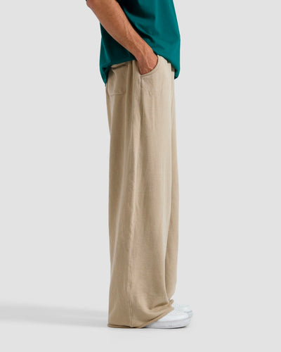 Washed Baggy Trousers With Raw Edges